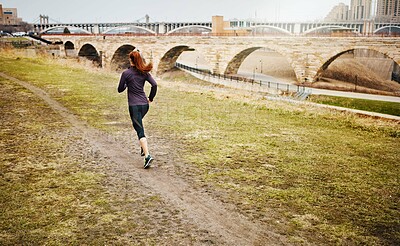 Buy stock photo Back, girl and running by bridge outdoor, endurance and speed with fitness in Germany. Training, female runner and preparation for marathon, challenge and exercise with workout in nature by mockup