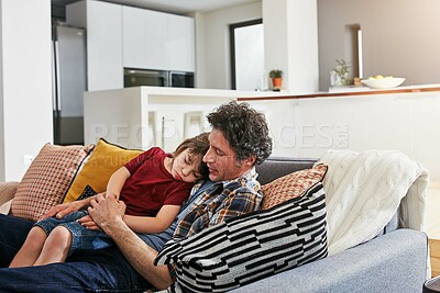 Buy stock photo Dad, sofa and comfort for sick boy in living room, home and rest for illness and support. Sad, father and single parent person on couch with so or child, fever and tired with embrace in family house
