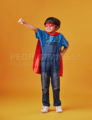 Buy stock photo Boy, halloween and superhero costume on studio background, confident and playing fantasy game. Male person, child and character to protect or serve justice, hero courage and proud fighter for power