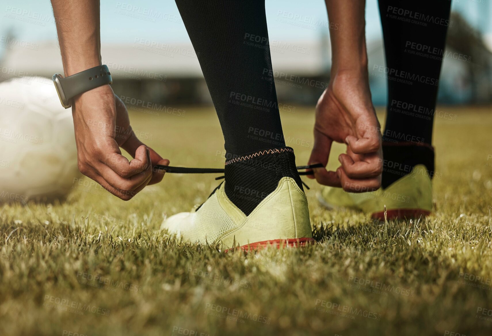 Buy stock photo Shoes tie, sports ball and soccer man or athlete on green grass ready for exercise or training. Fitness, workout and game or match of a sport person player before football cardio in nature and summer