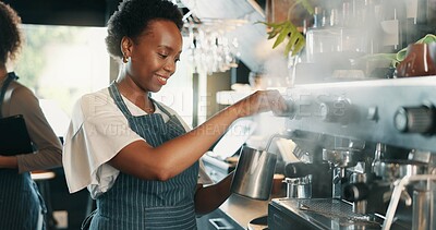 Buy stock photo Barista, machine and woman in coffee shop, smile and confidence with skills, friendly service and pride. Steam milk, people and employees in restaurant, retail and tea with mocha blend and brewing