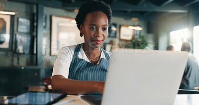Buy stock photo Typing, laptop and planning with black woman in cafe for product inventory, supplier contact or budget update. Menu discount, restaurant review and small business owner with employee in coffee shop