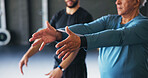 Hands, stretching and old man in gym, instructor and help with advice, feedback for technique and body workout. Closeup, exercise and personal trainer in wellness center, mature person and healthy