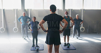 Buy stock photo Personal trainer, senior people and workout at gym with stretching, guide and teaching for fitness. Coach, group and warm up at class for training, learning or exercise at wellness club in retirement