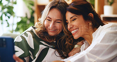 Buy stock photo Senior woman, daughter and selfie in house, bonding or catch up with memory for social media post. Home, Mothers day and happy female people, smile in picture and healthy family relationship
