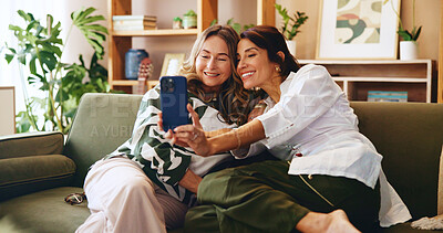 Buy stock photo Senior woman, daughter and selfie in home, bonding or catch up with memory for social media post on sofa. House, Mothers day and female people with smile in picture and healthy family relationship