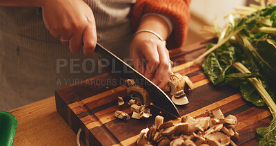 Buy stock photo Hands, mushroom and cutting board with cooking in home, meal prep and knife with spinach for healthy food. Person, chef and kitchen for organic produce, nutrition and diet for wellness at apartment