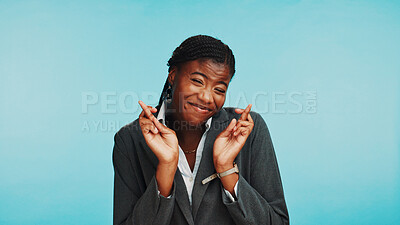 Buy stock photo Studio, black woman or hands with fingers crossed for hope, sign or wish for internship acceptance. Blue background, mockup or business person with prayer for good luck or nervous for startup results