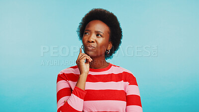 Buy stock photo Thinking, studio and face of black woman with doubt for choice, decision and options. Question, wondering and isolated person brainstorming for solution, ideas and planning on blue background