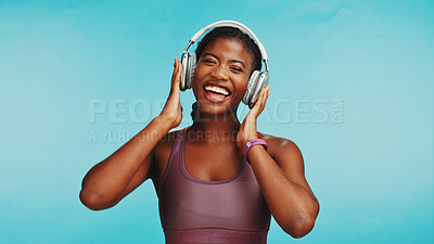 Buy stock photo Headphones, portrait or black woman in studio, fitness or healthy model on blue background. African person, exercise goals or athlete with headset, listen to music or audio with celebration and sound