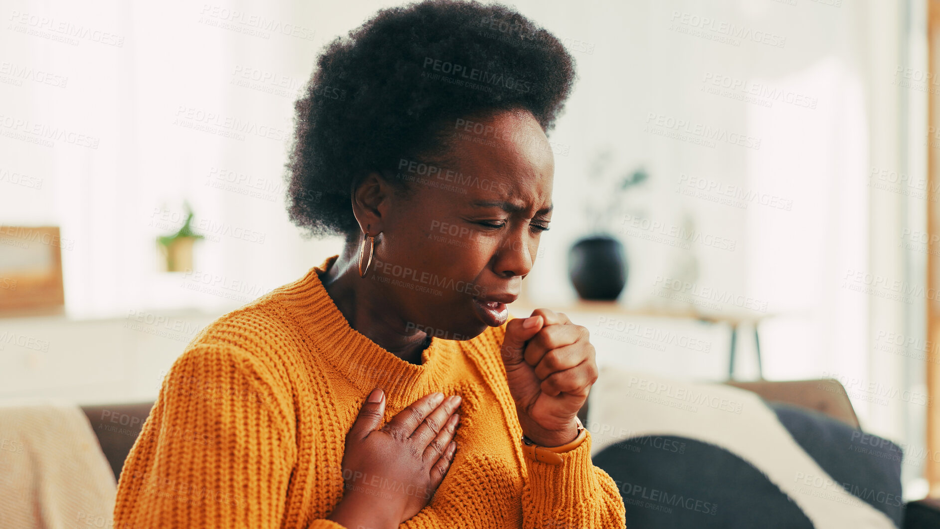 Buy stock photo Coughing, sick and black woman in home with flu, cold or allergies with viral infection. Illness, recovery and African female person with respiratory issue, tuberculosis or asthma in living room.