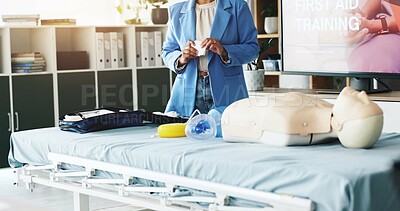 Buy stock photo Hands, person and bandage for first aid training for injury safety, demonstration lesson and workshop. Woman, explain and gauze for wound care, medical emergency and learning procedure of life saving