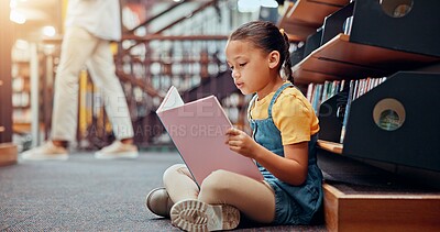 Buy stock photo Girl, kid and reading book in library, education and novel with fantasy, vocabulary skills and learning. School, student and child development with literature information, storytelling and growth