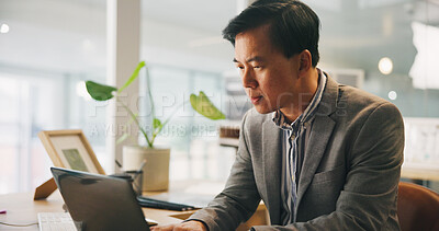 Buy stock photo Man, reading and laptop in office for business, email draft or connection for feedback. Mature accountant, typing or tech in agency for tax compliance, networking or website for company income filing