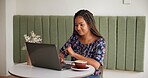 Freelancer, laptop and research in coffee shop for internet blog, startup planning and proposal. Smile, copywriter and creative black woman with remote work, technology and small business review