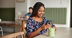 Happy woman, typing and social media with phone at cafe for remote work, email or chatting app. Female person, customer or freelancer with smile on mobile smartphone for communication at coffee shop