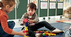 Education, children or playing with building blocks in classroom for creative imagination, motor skills or learning. Solution, student or stack toys at kindergarten for problem solving or development