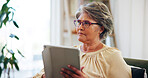 Home, thinking and senior woman with tablet, calm and planning for retirement in lounge or apartment. House, contemplating and elderly person with tech for insurance policy, online and living room