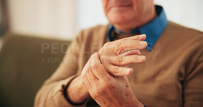 Buy stock photo Home, hands and senior man with wrist pain, arthritis and inflammation with carpal tunnel syndrome. Closeup, pensioner or elderly person with osteoporosis, fibromyalgia or parkinson disease in lounge