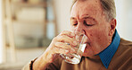 Drinking, water and senior man in home, healthcare and prevention of dehydration, thirsty and retirement. House, hydration and elderly person with liquid in living room, treatment and pensioner