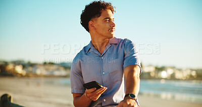 Buy stock photo Relax, nature and man with phone by beach on holiday, vacation and weekend on mobile app outdoor. Travel, notification and person by seaside on smartphone for social media, online chat and website