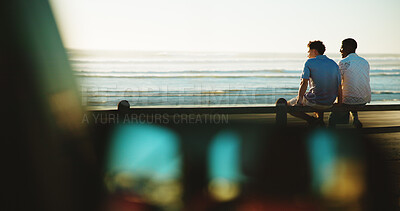 Buy stock photo Men, back and friends at beach for break with bonding, space and support outdoor. Sunset, people and happy on wood fence, travel or vacation to relax with connection in nature with ocean view