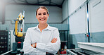 Portrait, smile and woman at robotics factory for production, manufacturing and industry inspection. Happy, technician and arms crossed with pride for automation, machine development and maintenance