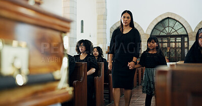 Buy stock photo Family, sad and mom with child in funeral holding hands for farewell, mourning loss or grief. Respect, goodbye or people with casket or death in Christian cathedral for burial, support or memorial