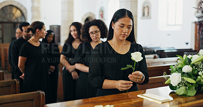 Buy stock photo Woman, rose and coffin at funeral for farewell service, mourning death and goodbye at burial ceremony. Person, flower and respect for rip, memorial comfort and emotional gathering at community church