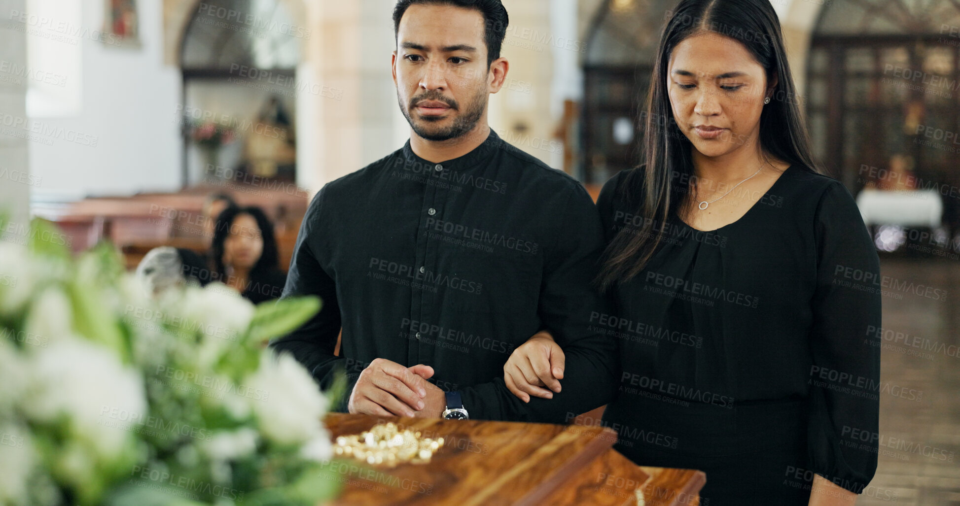 Buy stock photo Couple, coffin and funeral in church for death, pay respect and comfort for loss together. Sad man, woman and grief at memorial service with casket for goodbye, mourning and christian with farewell
