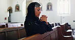 Church, senior woman and prayer for faith with religion, respect or worship God at funeral service. Christian, chapel and person praying for hope, holy spirit and widow with confession at memorial