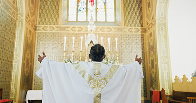 Buy stock photo Back view, bishop and church for praying as Christian for salvation, service and worship with faith. Religion, healing and respect with man or praise for guidance, protection and spiritual ceremony