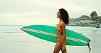 Woman, surfboard and smile at beach with view for water sports, hobby or outdoor in morning on holiday. Girl, surfer and happy in profile for training, fitness or ready for waves by ocean in Colombia