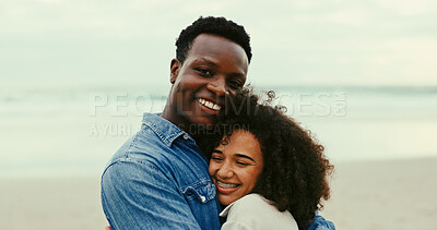 Buy stock photo Hug, smile and love with interracial couple at beach for romantic vacation, travel adventure and bonding. Happiness, holiday and portrait of man and woman embrace for honeymoon, trust and date