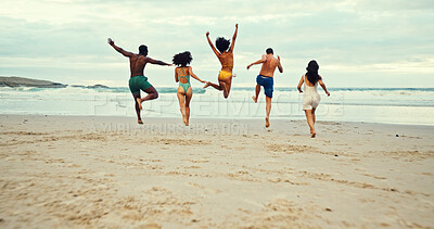 Buy stock photo Back, jumping and friends on beach with freedom, travel or excited on summer vacation. People, energy and running at ocean space for holiday, water adventure or bonding at reunion at tropical island