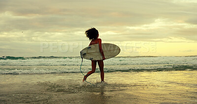 Buy stock photo Woman, back and surfboard at beach, running and sunrise with waves, tide and outdoor on holiday. Person, surfer and start with training for water sports, workout and ready for fitness in Brazil