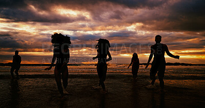 Buy stock photo Silhouette, running and friends on beach for sunset, freedom and excited on summer vacation. People, energy and playing at ocean space for travel holiday, adventure and splashing in water for fun