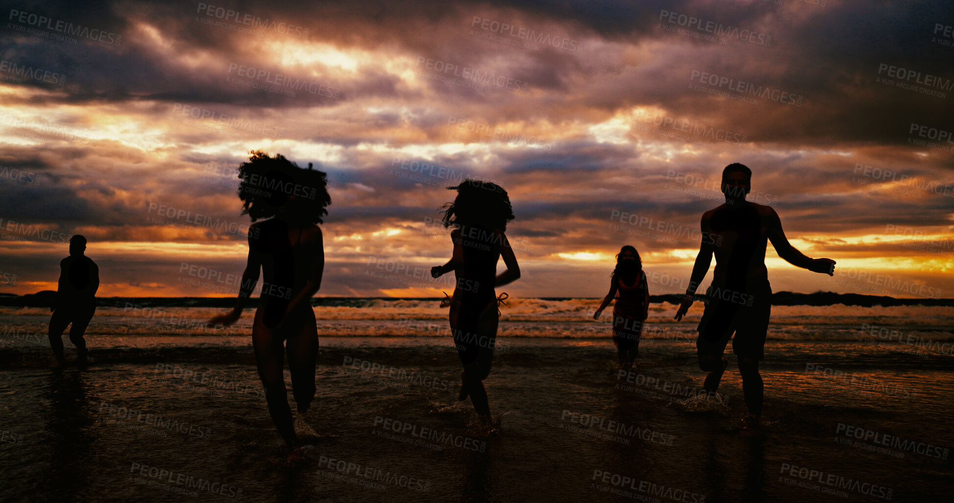Buy stock photo Silhouette, running and friends on beach for sunset, freedom and excited on summer vacation. People, energy and playing at ocean space for travel holiday, adventure and splashing in water for fun