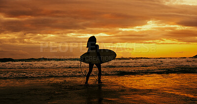 Buy stock photo Silhouette, sunset and person with surfboard, water and adventure for surfer on holiday, space or beach. Summer vacation, travel and woman with fitness for sport, evening and hobby in nature or ocean