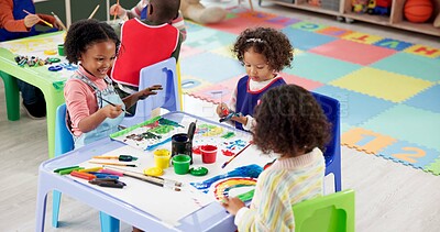 Buy stock photo Art, children and painting hands in class for learning, creative talent and motor skill development in preschool. Education, students and girls drawing on palm with color on brush for rainbow project