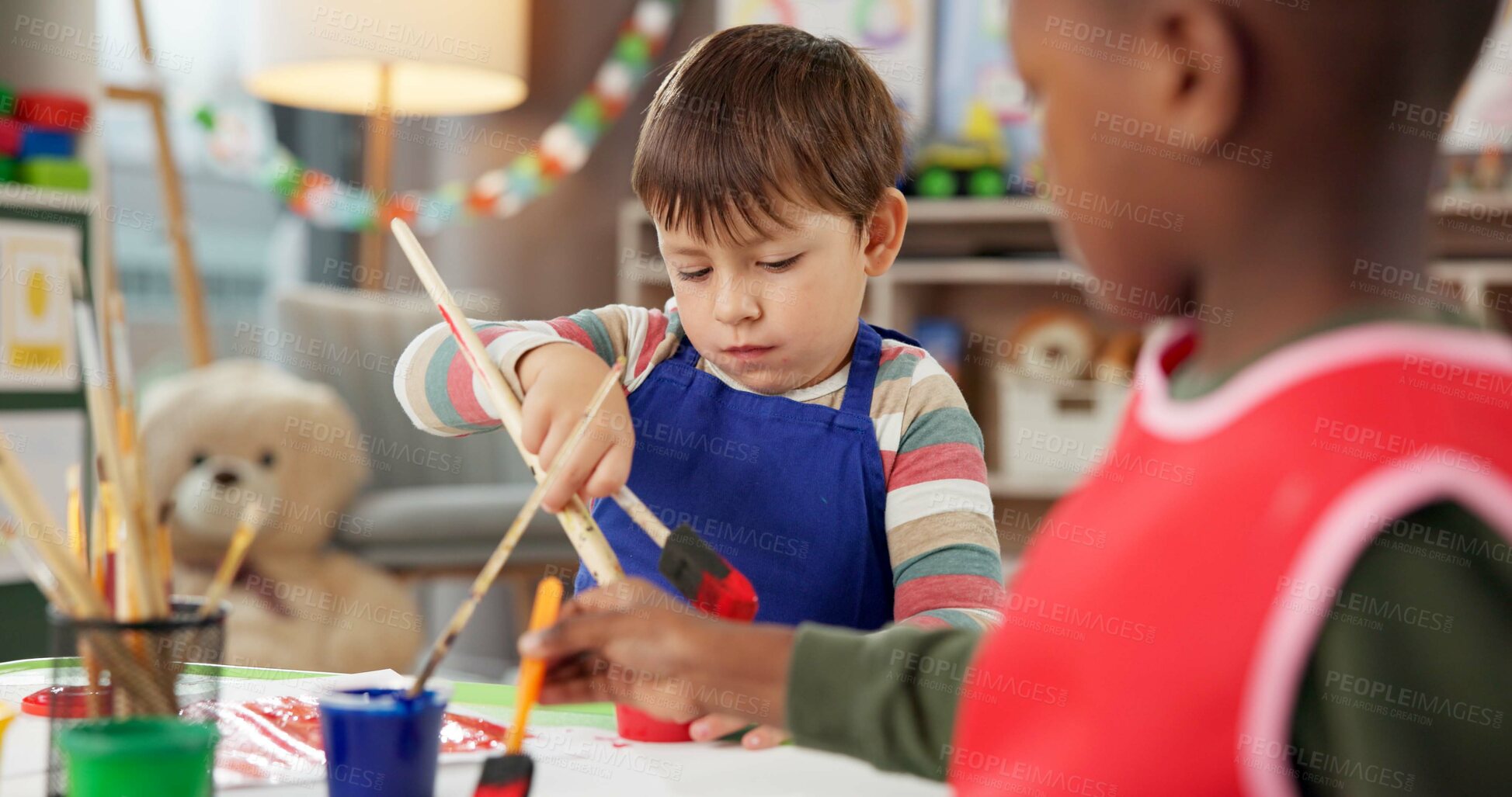 Buy stock photo Education, kids and boy painting for art, creative talent or development in preschool class. Learning, students drawing and children with watercolor for growth, artwork and sketch on paper with brush