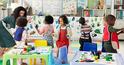 Buy stock photo Handprint, painting and children with paper in classroom for creative lesson, education and development. School, students and kids learning with colors for fun activity, art project and motor skills