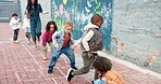 Kindergarten, children and outdoor playing with teacher for childhood development, game or hopscotch. Group, kids or learners jumping with fun activity at school for hopping or skipping on playground