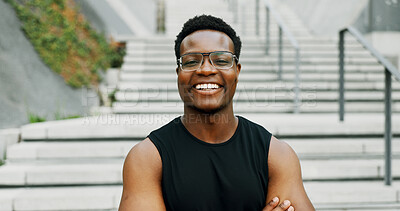Buy stock photo Black man, portrait and smile in city for fitness, health and confident athlete with pride, ambition and outdoor sports. African male person, urban and exercise in town with happiness in Tanzania
