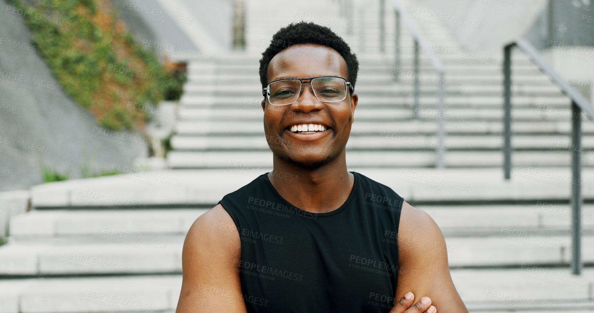 Buy stock photo Black man, portrait and smile in city for fitness, health and confident athlete with pride, ambition and outdoor sports. African male person, urban and exercise in town with happiness in Tanzania