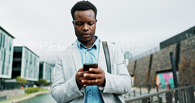 Buy stock photo Walking, phone and business man in city online for morning commute, travel and journey to office. Professional, corporate and African person on smartphone for networking, contact and internet in town