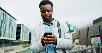 Buy stock photo Travel, phone and business black man in city online for morning commute, walking and journey to office. Professional, corporate and person on smartphone for networking, contact and internet in town