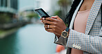 Hands, phone and business woman in city online for morning commute, travel and journey to office. Professional, corporate and person on smartphone for networking, typing email and internet in town