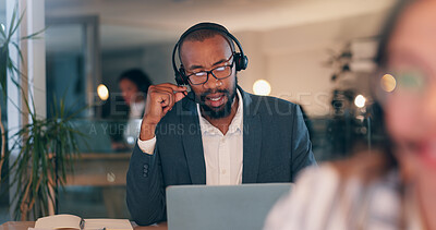 Buy stock photo Man, headset and talking at call center, night and advisory services at legal agency with laptop. Person, virtual consultation and computer with voip, mic or contact us with help desk job at law firm