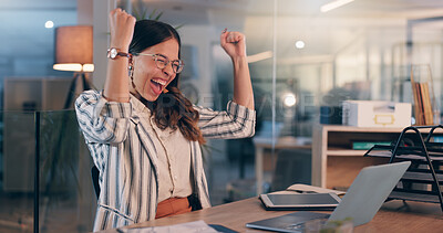 Buy stock photo Woman, fist and winning with laptop at office, night or excited for goals, success or promotion at startup. Person, writer and happy for cheers, celebration or approval for project at creative agency